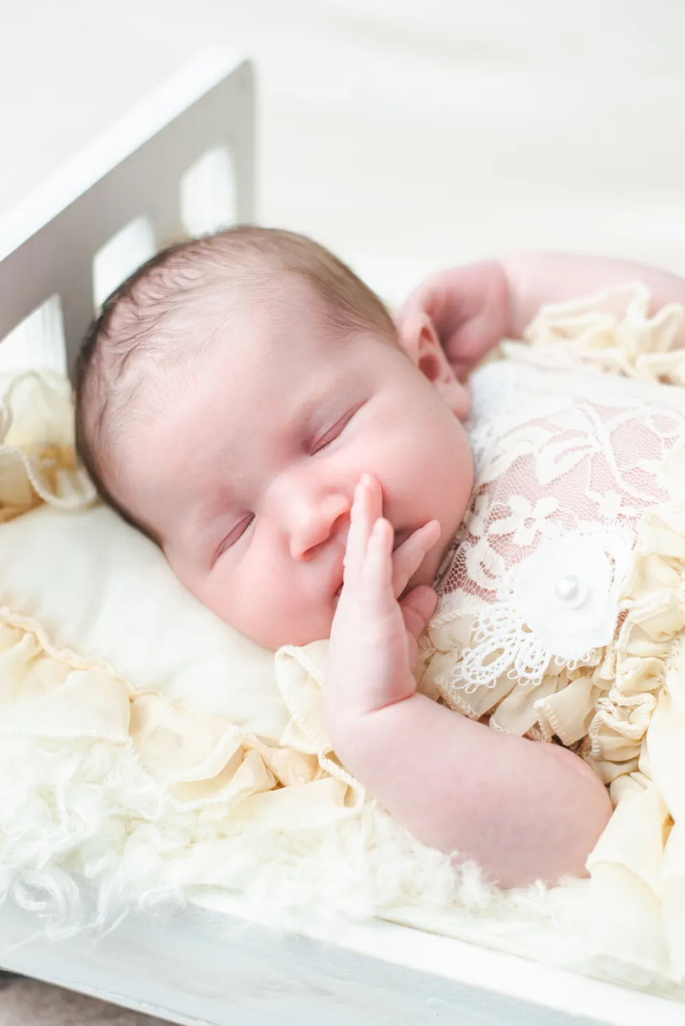 A baby sleeping peacefully in a crib
